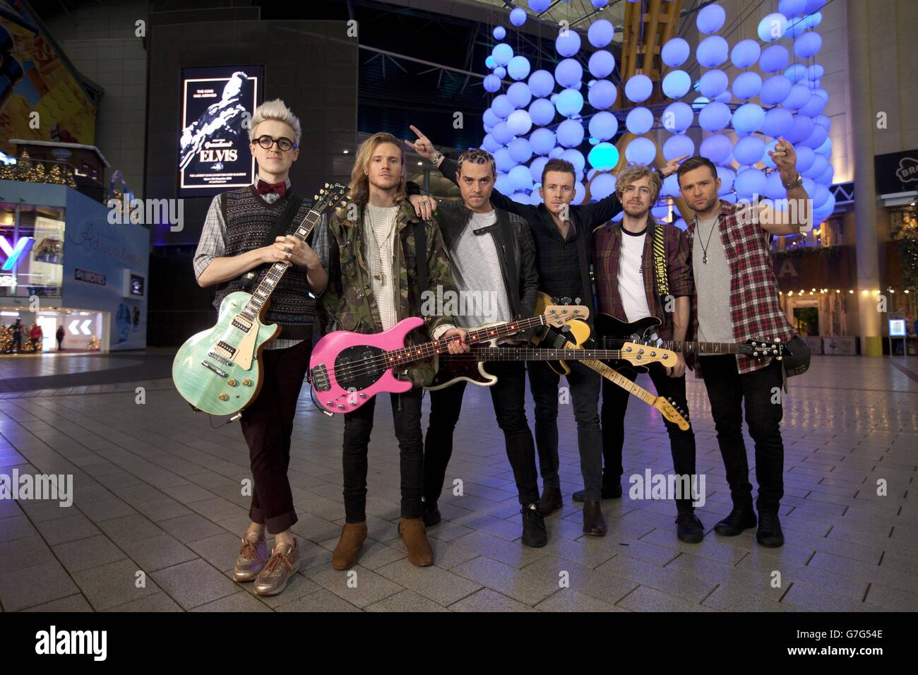 McBusted are (left to right) Tom Fletcher, Dougie Poynter, Matt Willis, Danny Jones, James Bourne and Harry Judd, who have returned to the iconic O2 in London to recreate their infamous air kick in celebration of their new DVD Tourplay and McBusted Live at the O2. Stock Photo