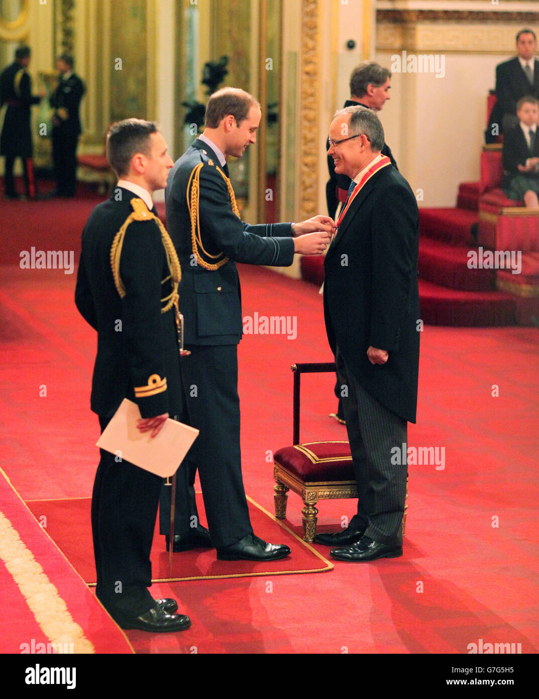 Sir Richard Collas from Guernsey is made a Knight Bachelor of the British Empire by the Duke of Cambridge at Buckingham Palace during an Investiture ceremony at Buckingham Palace, London. Stock Photo