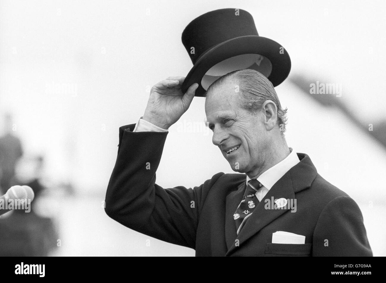 The Duke of Edinburgh doffs his topper as his carriage arrives at Smiths Lawn, Windsor, during the opening ceremony of the World Carriage Driving Championships. Stock Photo