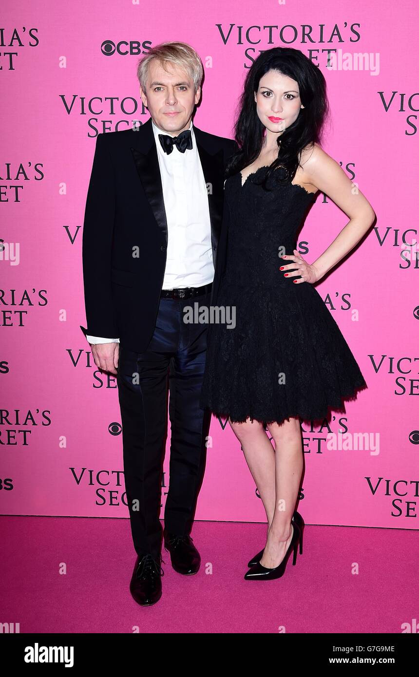 Nick Rhodes and Nefer Suvio arriving for the Victorias Secret Fashion Show 2014 held at Earls Court, London England. Stock Photo