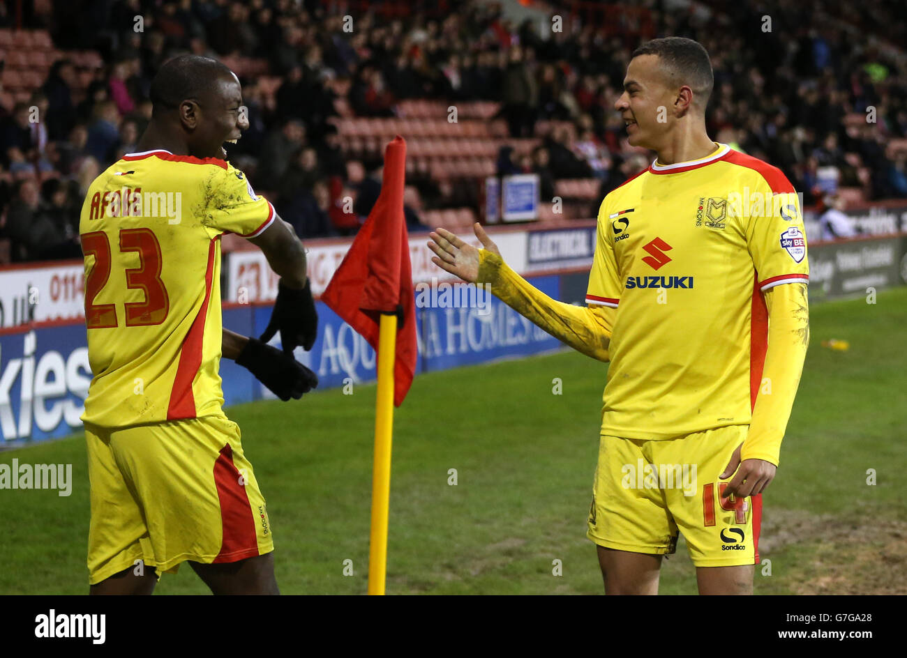 MK Dons' Dele Alli (left) and Tottenham Hotspurs' Tom Carroll