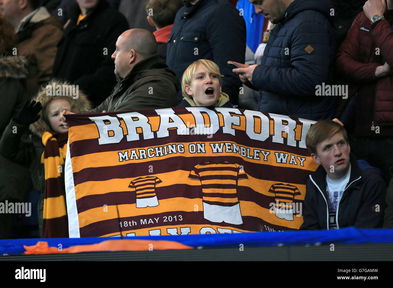 Bradford City fans show support for their team with a banner in the