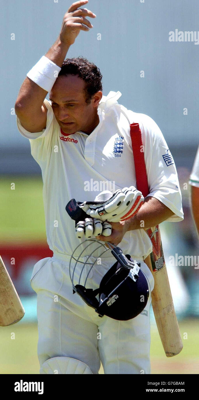 England's Mark Butcher leaves the field at the lunch break during the ...