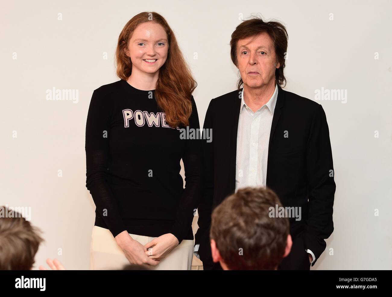 Sir Paul McCartney is greeted by Lily Cole as he arrives to give a talk to Cole's Impossible organisation in central London where he discussed songwriting and particularly his contribution to the the new Destiny video game. Stock Photo
