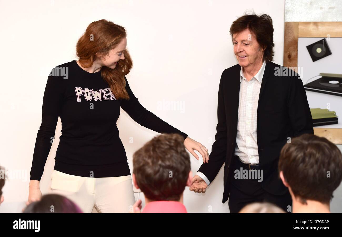 Sir Paul McCartney is greeted by Lily Cole as he arrives to give a talk to Cole's Impossible organisation in central London where he discussed songwriting and particularly his contribution to the the new Destiny video game. Stock Photo