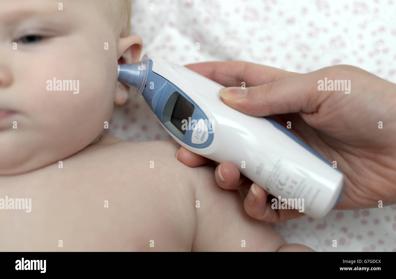 A months old baby temperature checked doctor digital thermometer hires