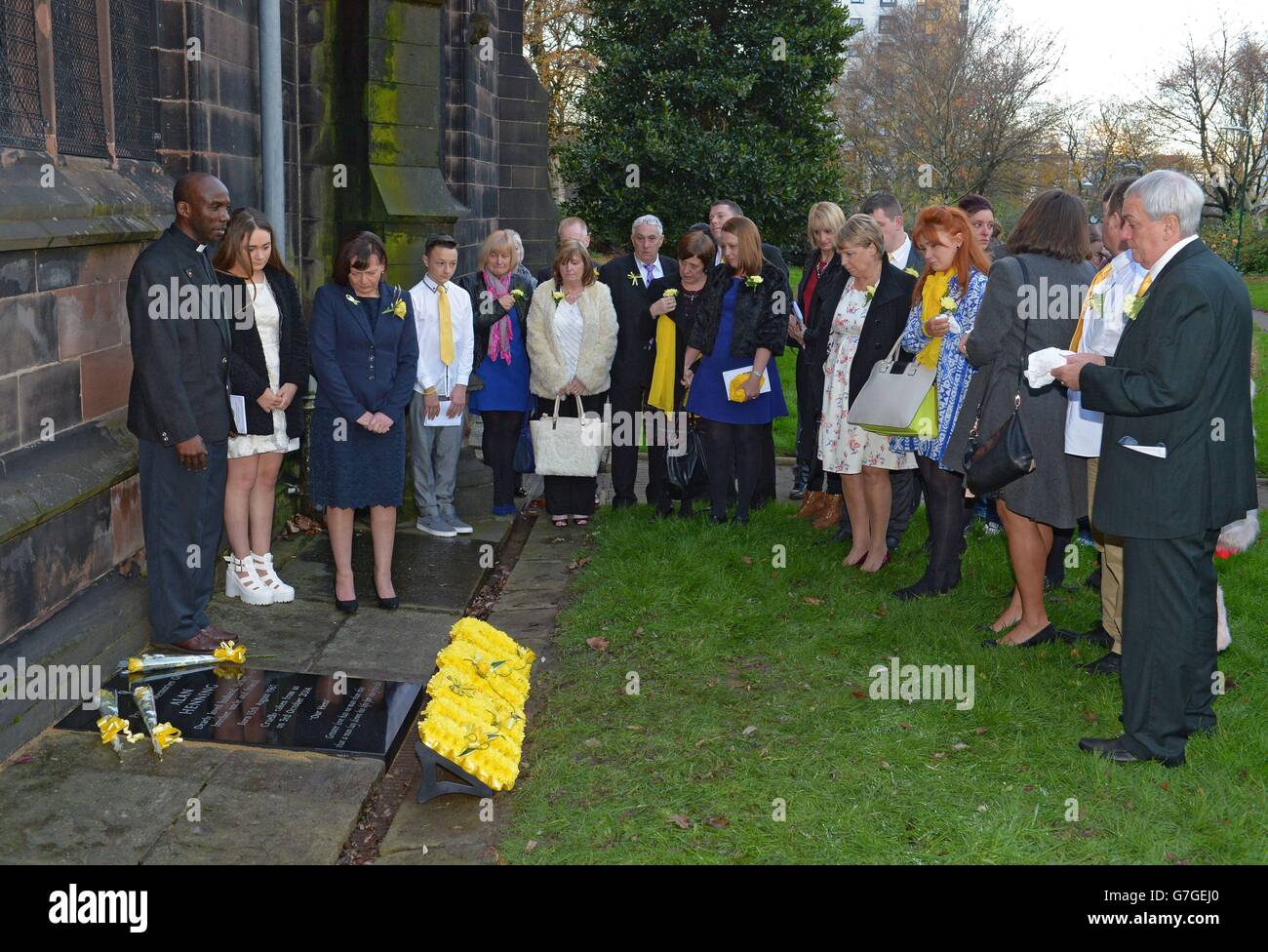 Family and friends gather as a memorial stone is unveiled in memory of ...