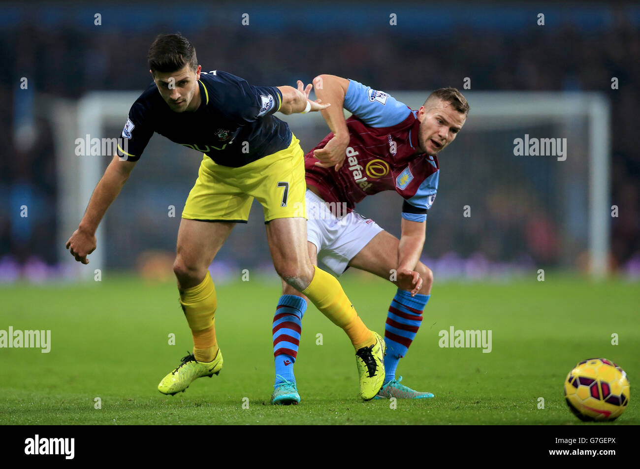 Southampton's Shane Long (left) and Aston Villa's Tom Cleverley battle for the ball during the Barclays Premier League match at Villa Park, Birmingham. PRESS ASSOCIATION Photo. Picture date: Monday November 24, 2014. See PA story SOCCER Villa. Photo credit should read Nick Potts/PA Wire. Maximum 45 images during a match. No video emulation or promotion as 'live'. No use in games, competitions, merchandise, betting or single club/player services. No use with unofficial audio, video, data, fixtures or club/league logos. Stock Photo