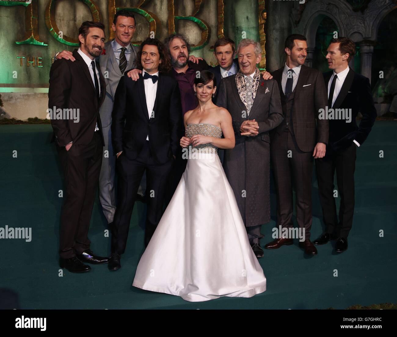 Cast members (left to right) Lee Pace, Luke Evans, Orlando Bloom, director Peter Jackson, Evangeline Lilly, Martin Freeman, Sir Ian McKellen, Richard Armitage, and Benedict Cumberbatch on the green carpet for the premiere of The Hobbit: Battle of the Five Armies, at the Odeon Leicester Square in central London. Stock Photo