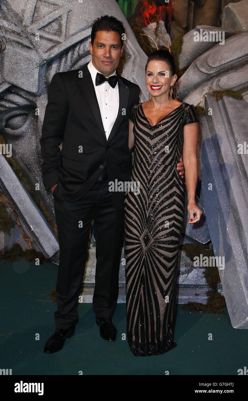 Manu Bennett and his partner Karin Horen arrive on the green carpet for the premiere of The Hobbit: Battle of the Five Armies, at the Odeon Leicester Square in central London. Stock Photo