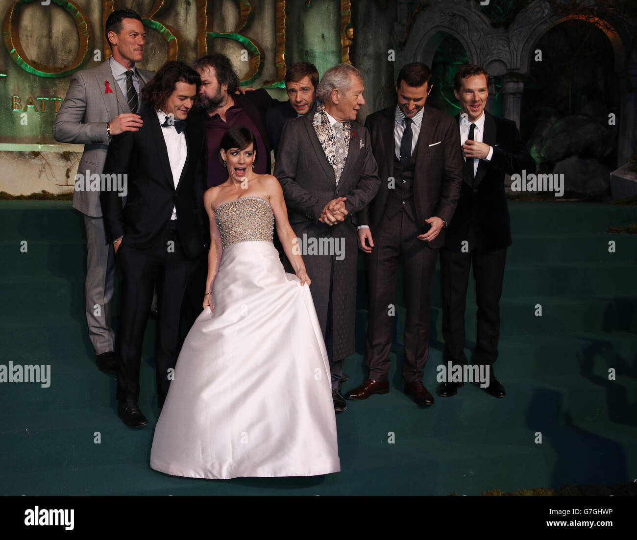 Cast members, (left - right) Luke Evans, Orlando Bloom, director Peter Jackson, Evangeline Lilly, Martin Freeman, Ian McKellen, Richard Armitage, and Benedict Cumberbatch on the green carpet for the premiere of The Hobbit: Battle of the Five Armies, at the Odeon Leicester Square in central London. Stock Photo