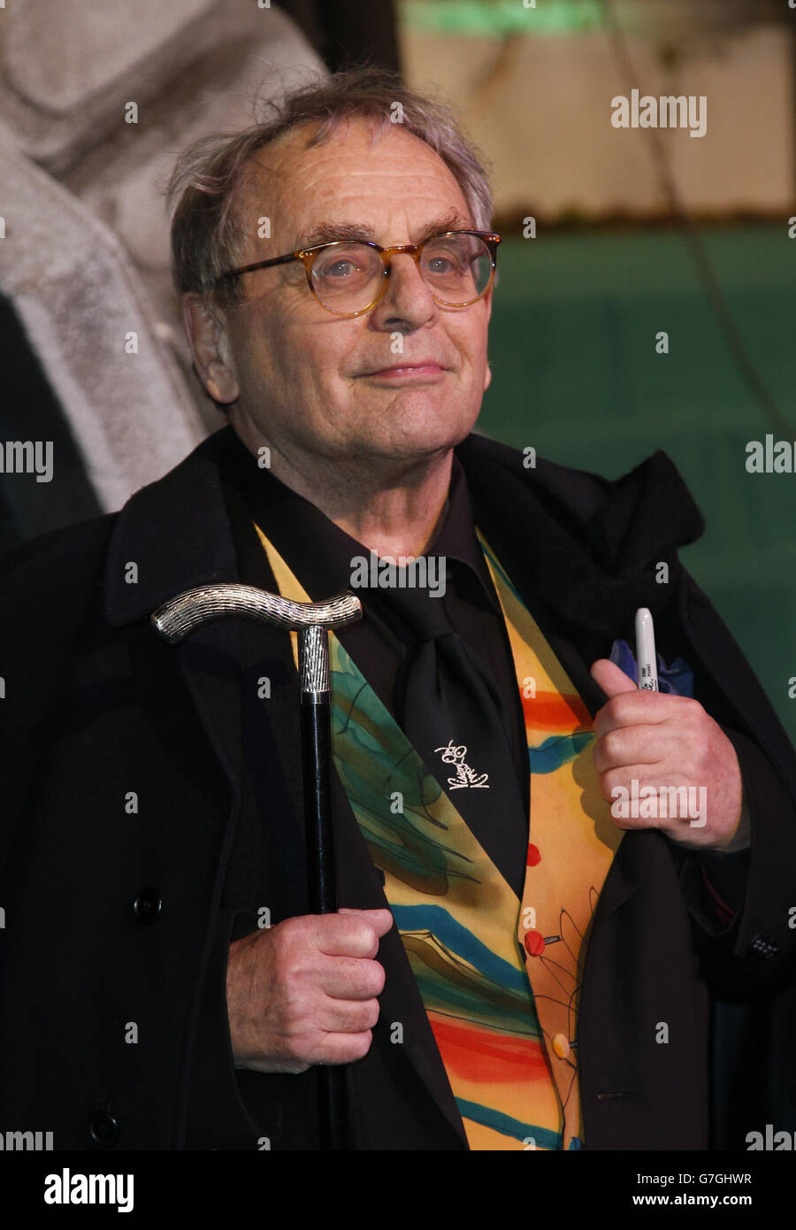 Sylvester McCoy arrives on the green carpet for the premiere of The Hobbit: Battle of the Five Armies, at the Odeon Leicester Square in central London. Stock Photo
