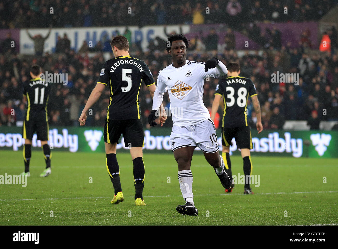 Swansea City's Wilfried Bony celebrates scoring their first goal of the game during the Barclays Premier League match at the Liberty Stadium, Swansea. PRESS ASSOCIATION Photo. Picture date: Sunday December 14, 2014. See PA story SOCCER Swansea. Photo credit should read Nick Potts/PA Wire. Maximum 45 images during a match. No video emulation or promotion as 'live'. No use in games, competitions, merchandise, betting or single club/player services. No use with unofficial audio, video, data, fixtures or club/league logos. Stock Photo
