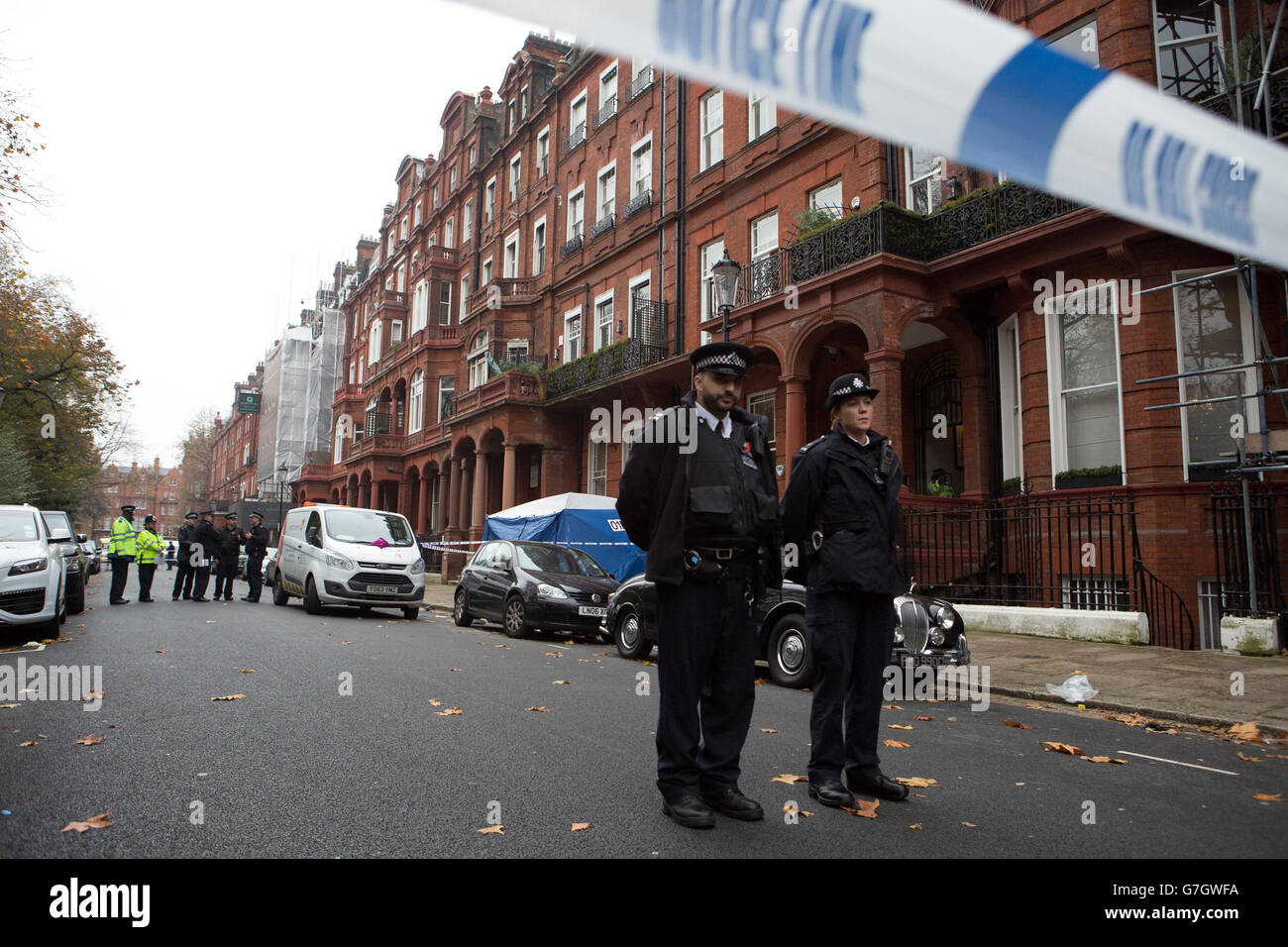 Police at the scene in Cadogan Square, London, after a balcony collapsed killing two men and injuring at least six others. Stock Photo
