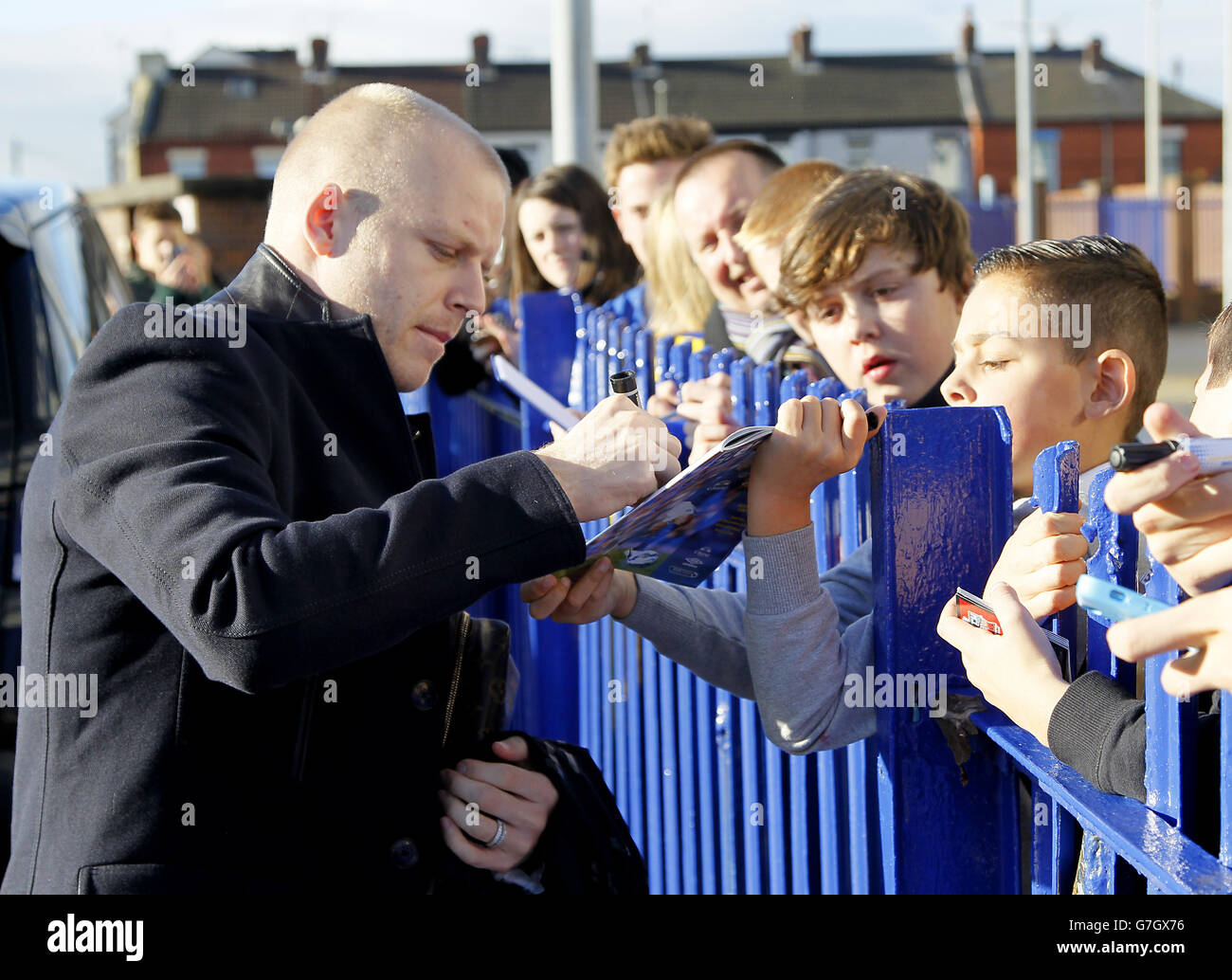 Everton's Steven Naismith signs autographs for fans outside Goodison Park. Stock Photo
