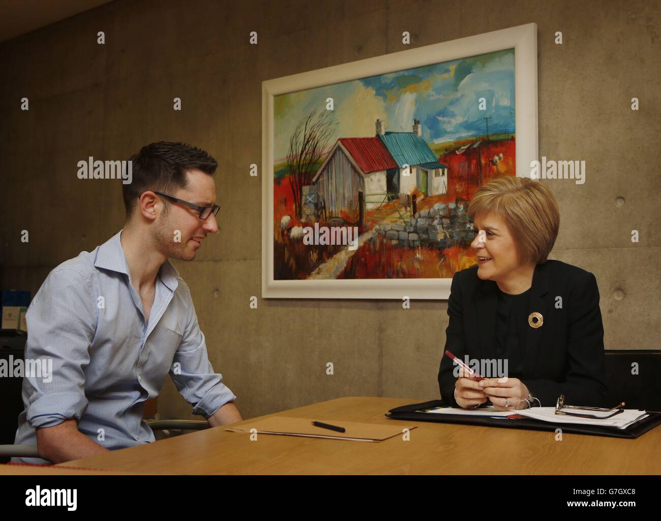 First Minister Nicola Sturgeon meets terminally ill Motor Neurone Disease campaigner Gordon Aikman at the Scottish Parliament in Edinburgh. Stock Photo