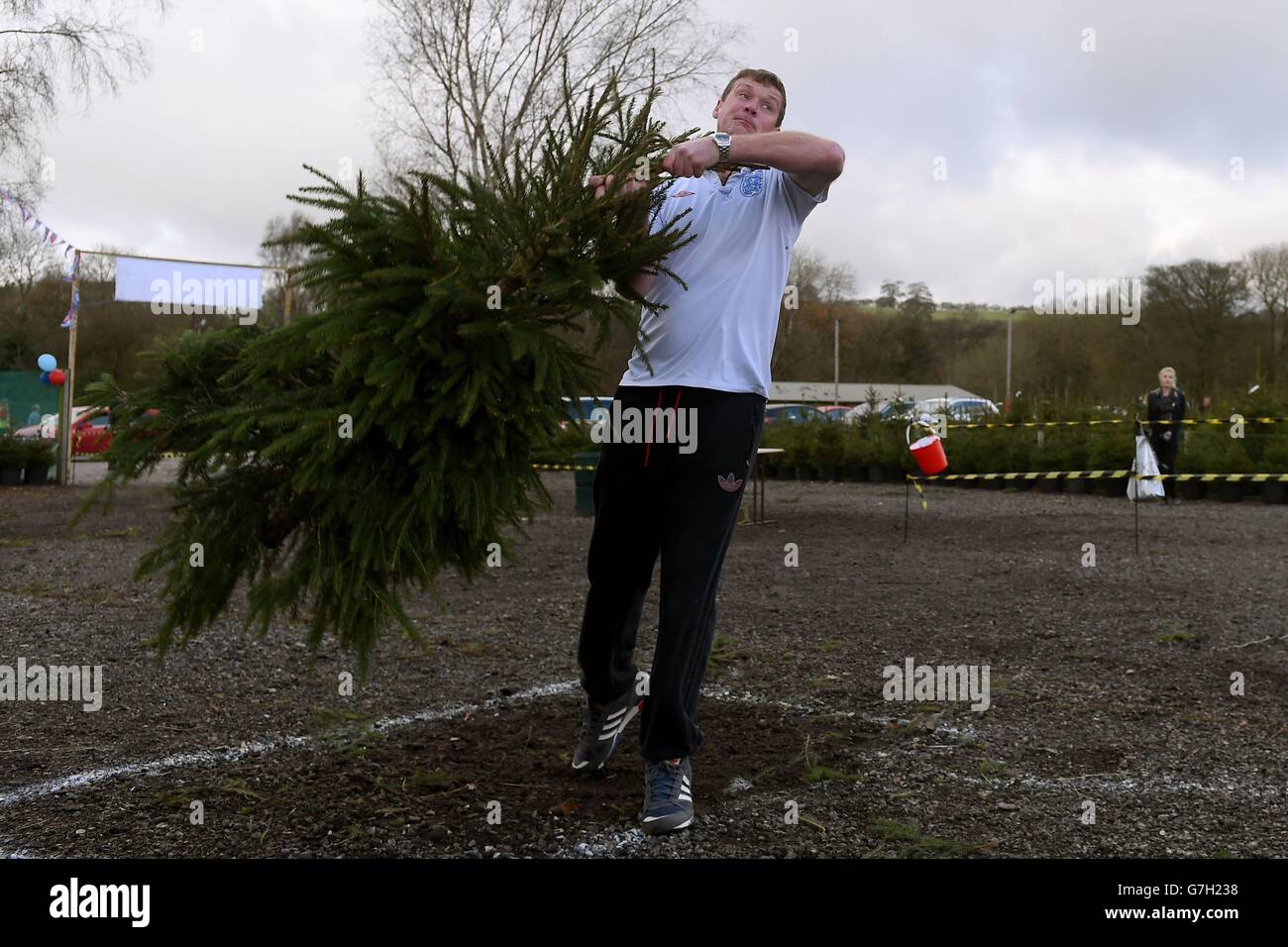 Owen Davis takes part in The UK Christmas Tree Throwing Championships