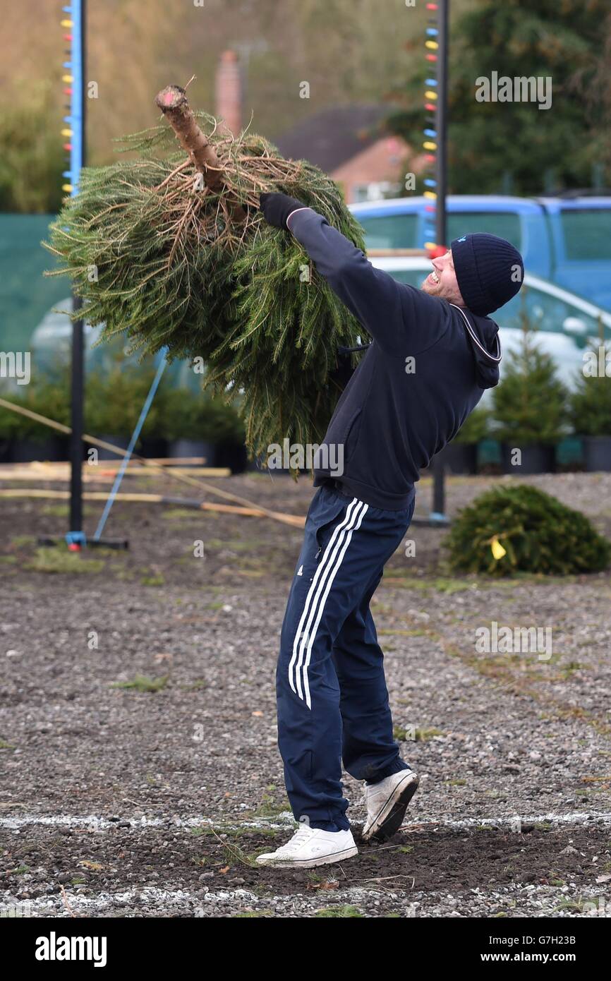A competitor takes part in The UK Christmas Tree Throwing Championships