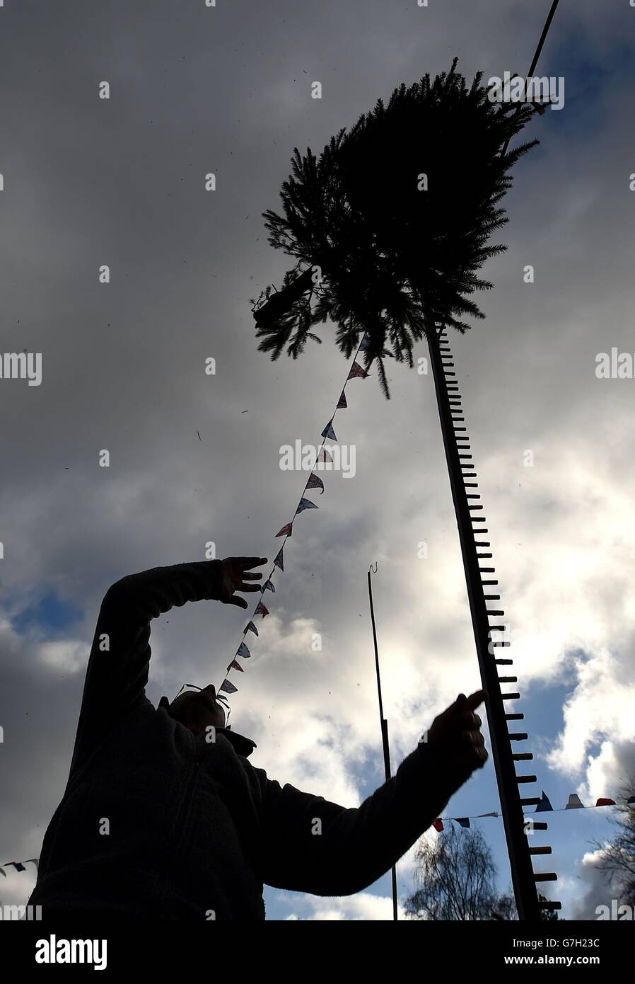 A competitor takes part in The UK Christmas Tree Throwing Championships
