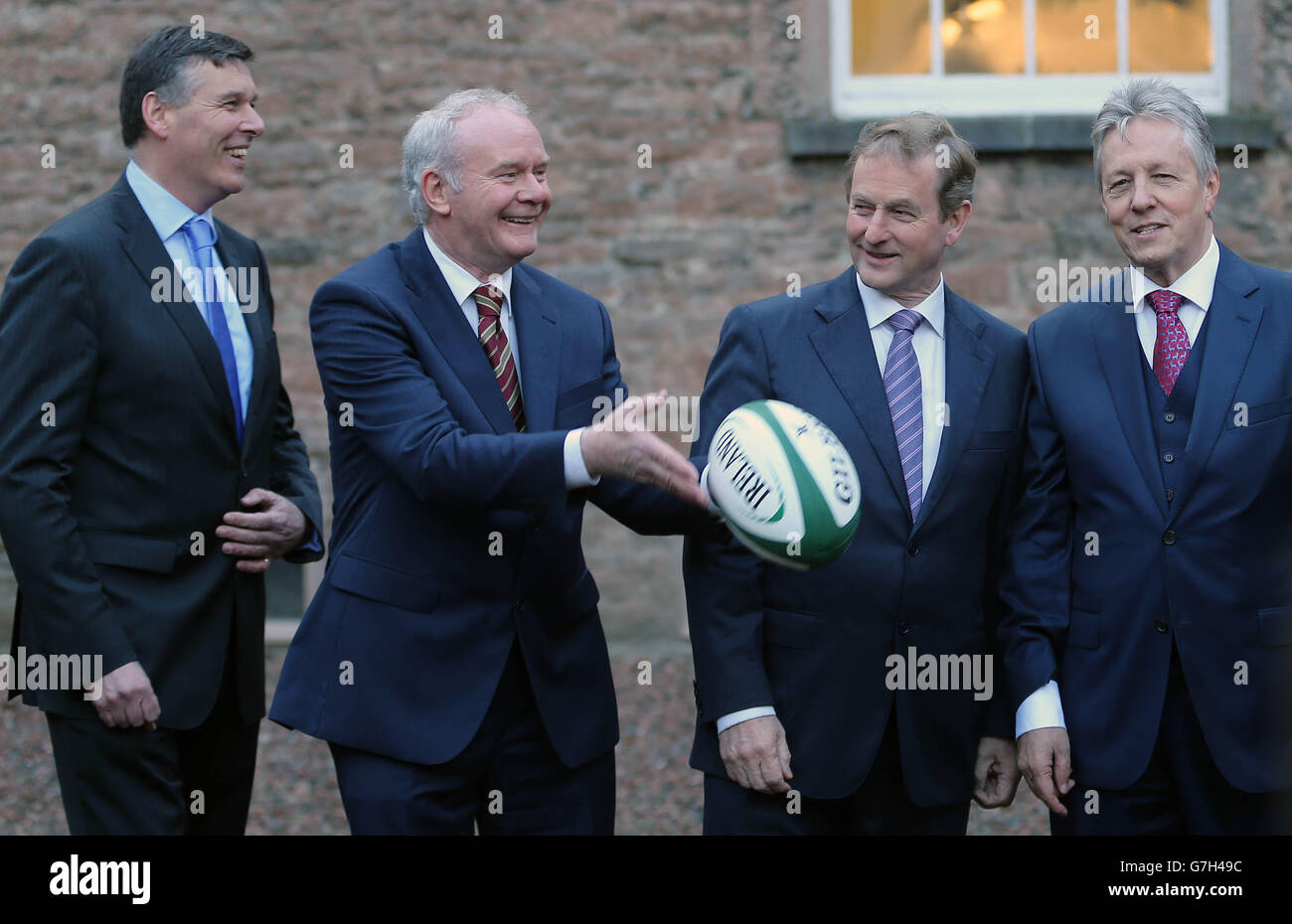 Philip Browne (CEO IRFU), Northern Ireland Deputy First Minister Martin McGuinness, Taoisech Enda Kenny and Northern Ireland First Minister Peter Robinson during the launch of an all-Ireland bid to host the 2023 Rugby World Cup at the The Royal School, Armagh. Stock Photo