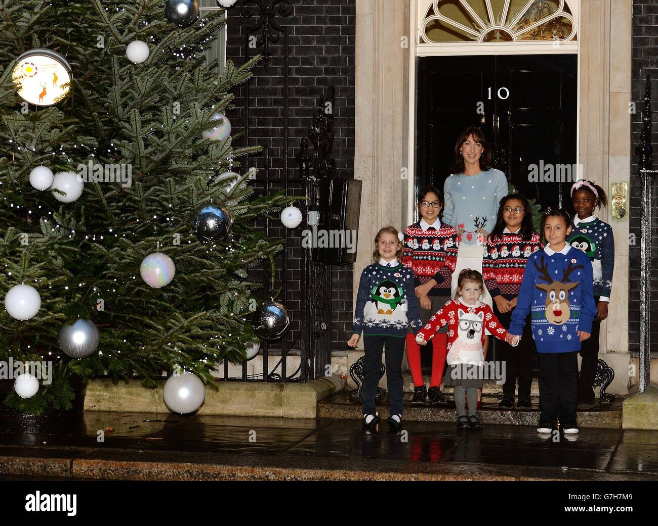 Samantha Cameron, wife of the Prime Minister David Cameron, stands with children for the Save the Children Christmas Jumper Day outside 10 Downing Street, London. Stock Photo
