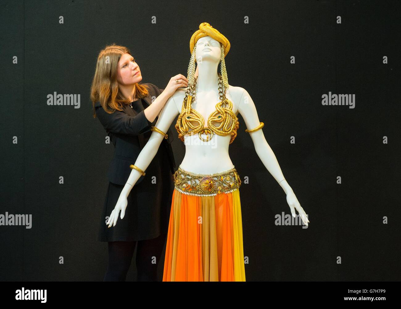 A Christie's employee views a harem costume worn by Marilyn Monroe for a 1958 Life magazine photoshoot, valued at &Acirc;£300,000 to &Acirc;£500,000, part of Christie's 20/21 Pop Culture Sale on 16th December 2014. Stock Photo