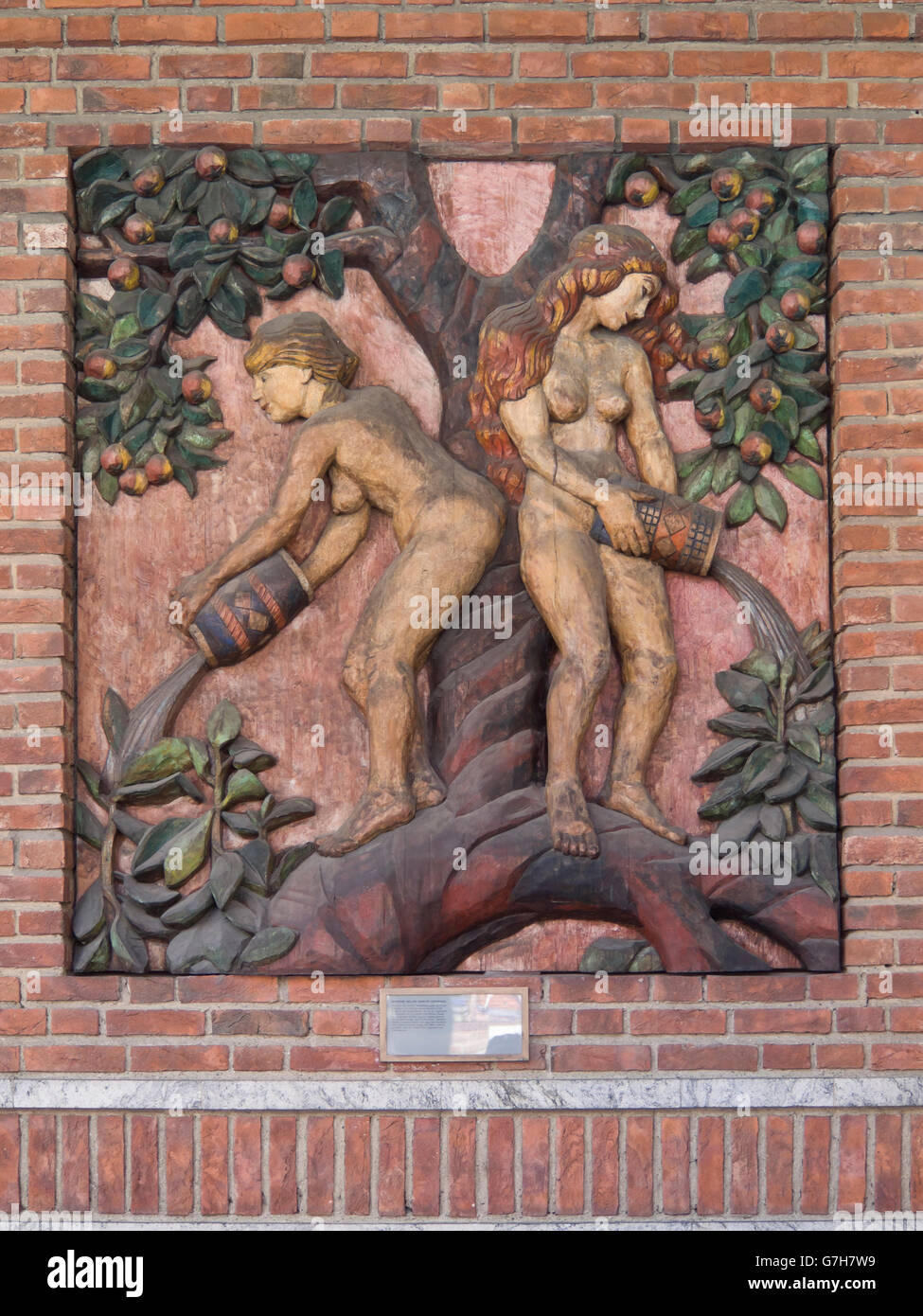 Woodcarving relief on the exterior facade of the Oslo City hall in Norway by Dagfin Werenskiold, norns watering the ash Yggdrasil Stock Photo