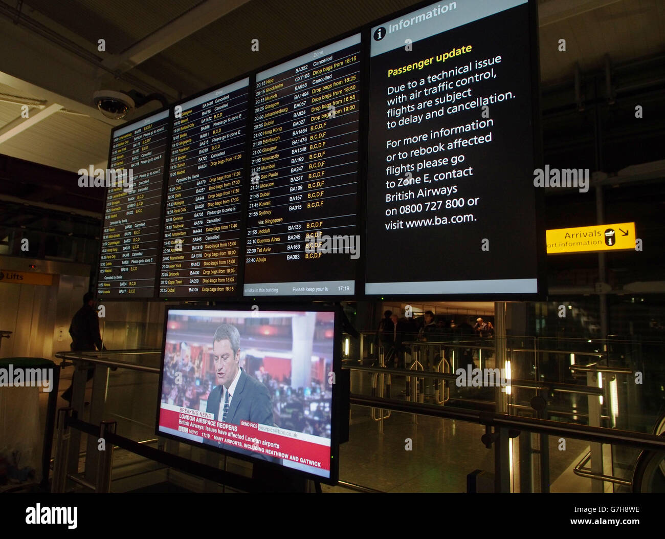 An information board at Terminal 5 of Heathrow Airport as dozens of ...