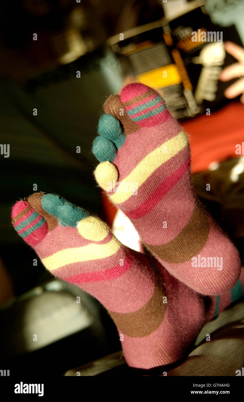 Feet wearing colourful socks Stock Photo Alamy