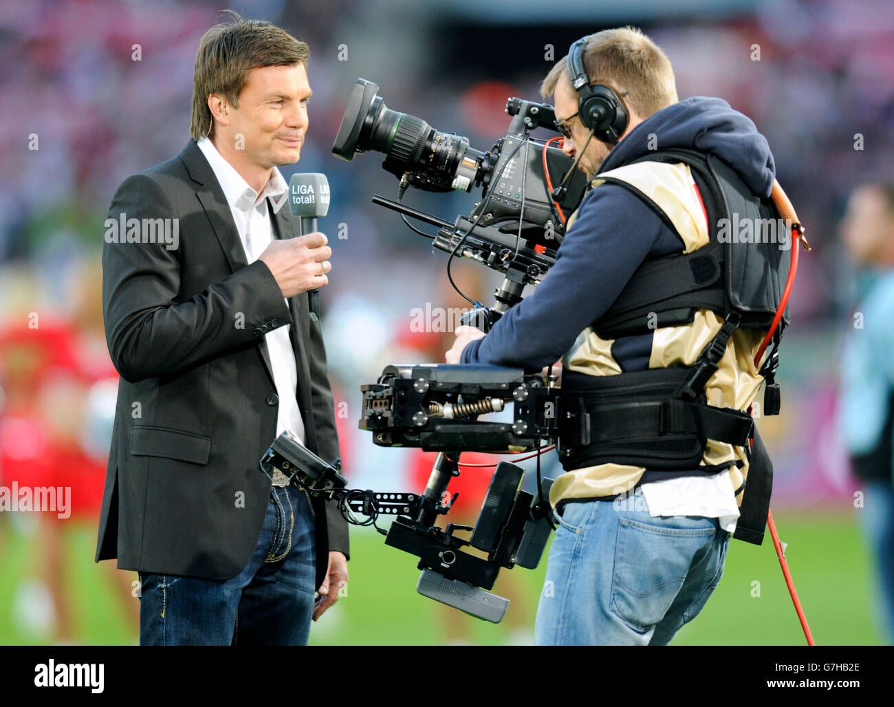 Thomas Helmer, host of 'Sport 1', in front of the camera, Bundesliga, federal league, 1. FC Koeln - Hannover 96 2:0 Stock Photo