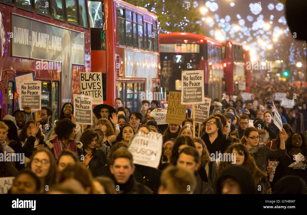 Protesters march through central London after demonstrating outside the