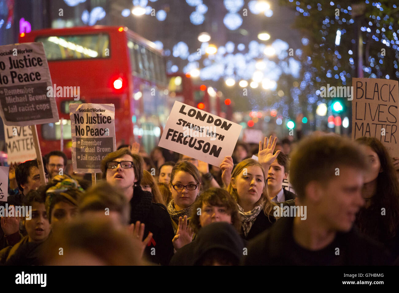 Protesters march through central London after demonstrating outside the