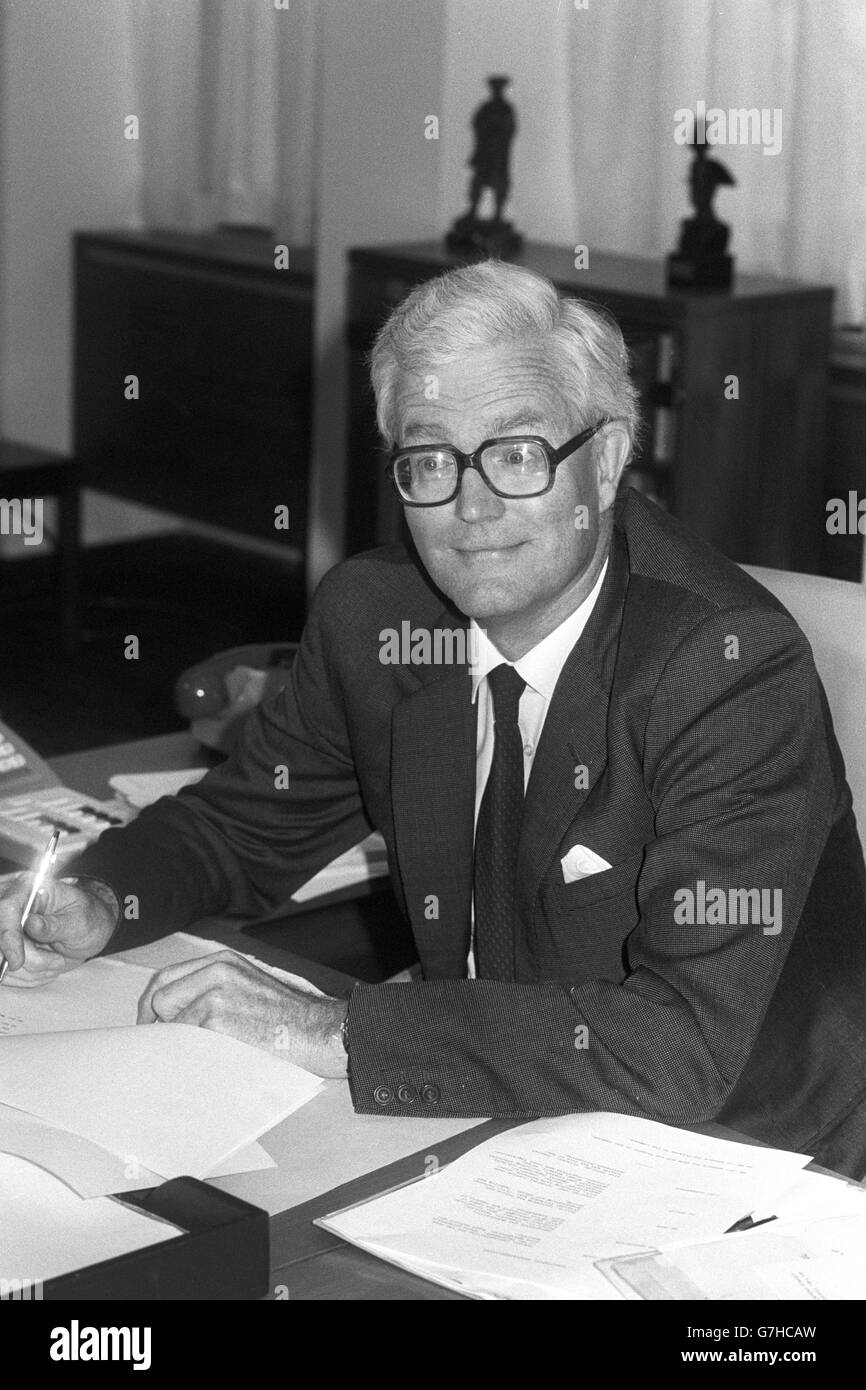 Douglas Hurd, the newly appointed Home Secretary, at his desk at the Home Office in London. Stock Photo