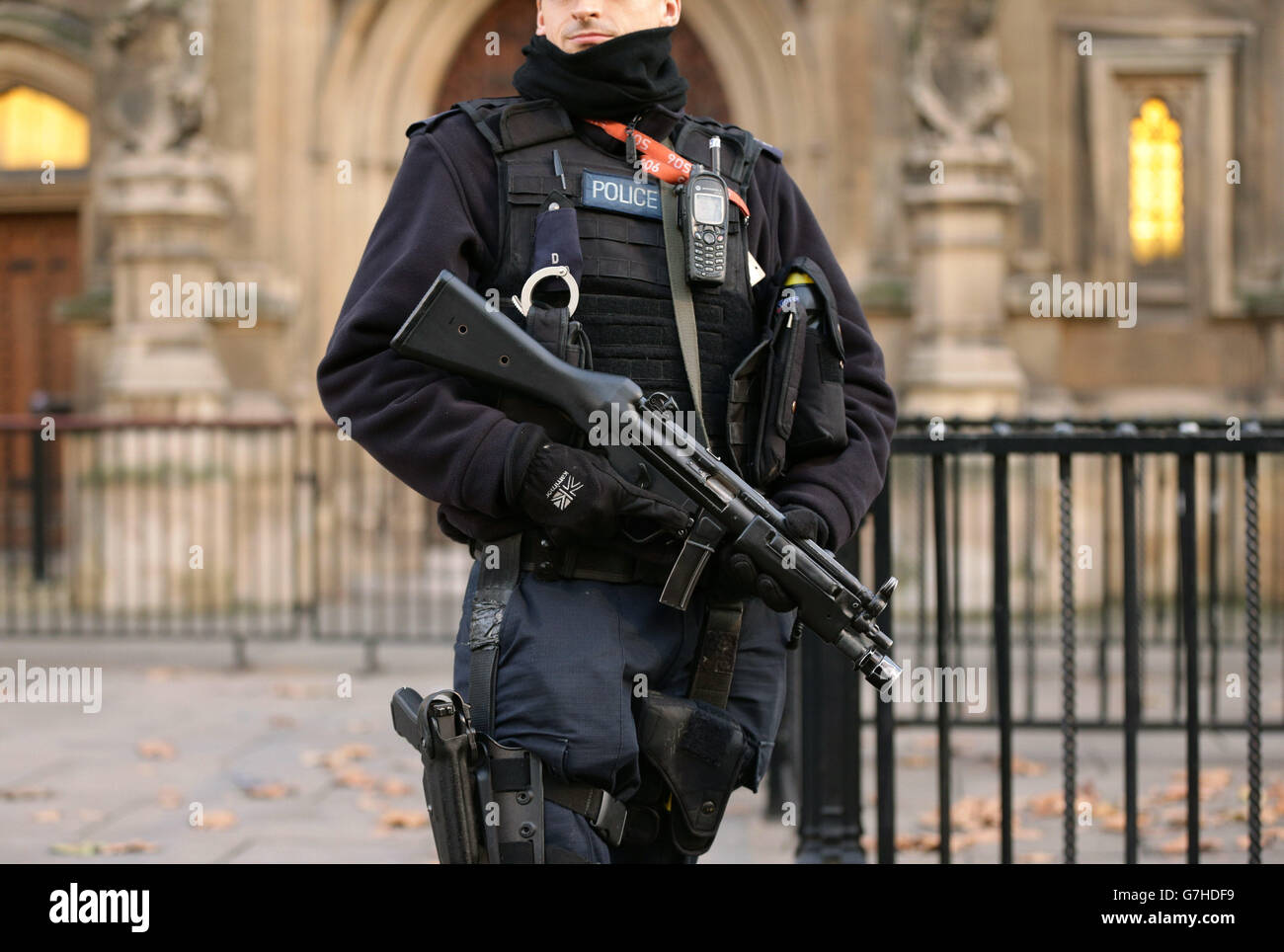An armed police officer on duty outside the Houses of Parliament in ...