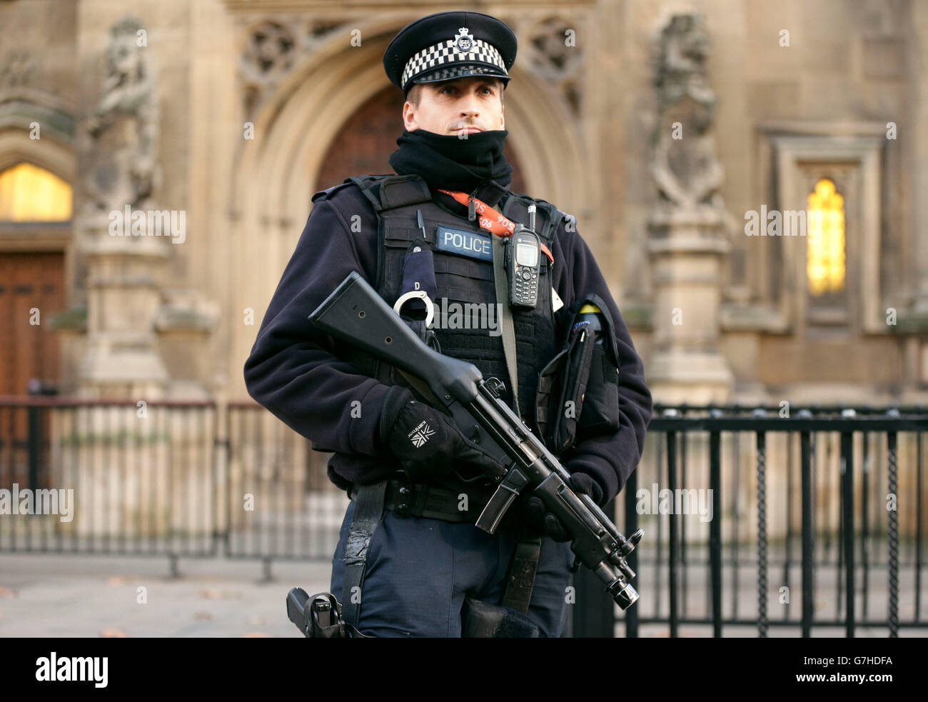 An armed police officer on duty outside the Houses of Parliament in ...