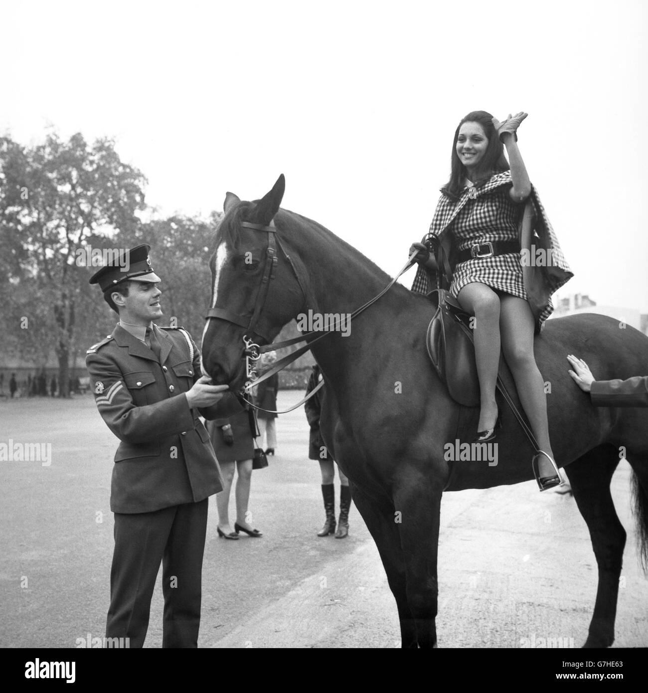 Miss Venezuela Marcia Rita Piazza poses on a Household Cavalry mount at Wellington Barracks. Finalists in the Miss World competition were taking part in a sightseeing tour of London. Stock Photo