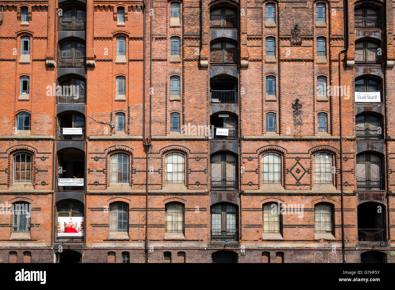 View of historic red brick warehouses at Speicherstadt beside canals in Hamburg Germany Stock Photo