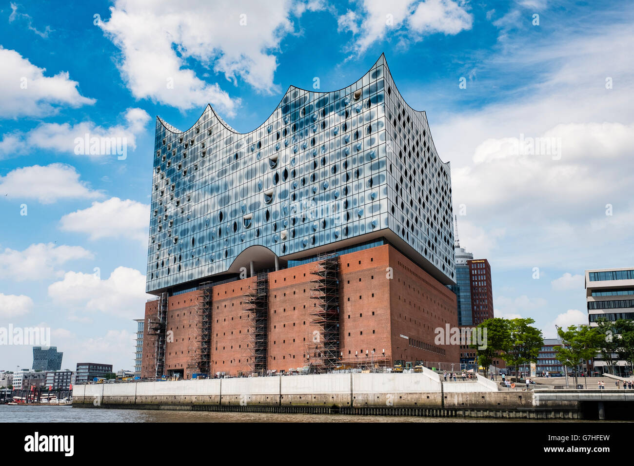 View of new Elbphilharmonie concert hall nearing completion on River Elbe in Hamburg Germany Stock Photo