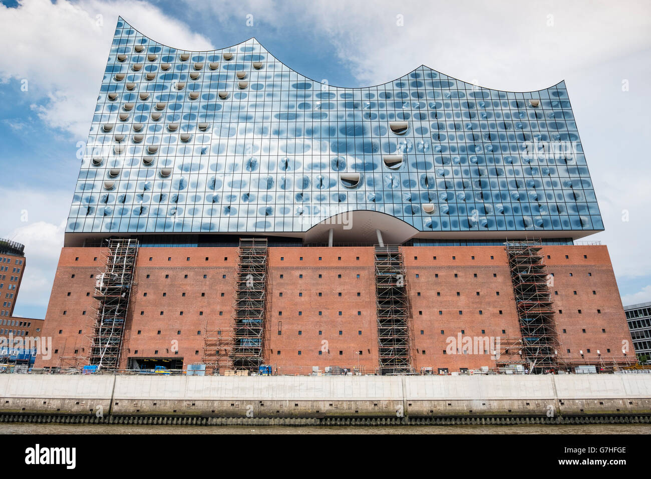 View of new Elbphilharmonie concert hall nearing completion on River Elbe in Hamburg Germany Stock Photo