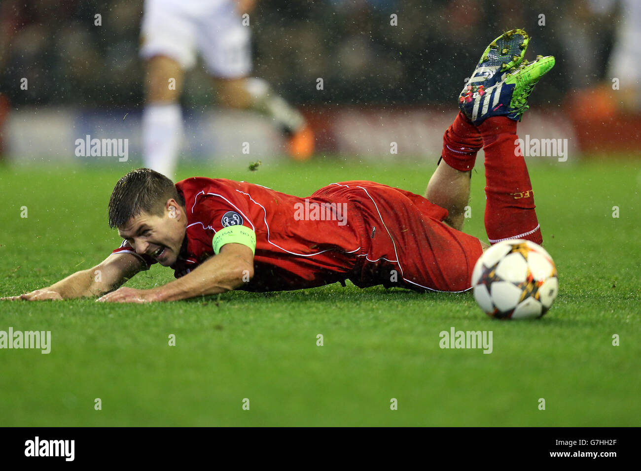 Soccer - UEFA Champions League - Group B - Liverpool v Basel - Anfield. Liverpool's Steven Gerrard lays on the floor after going down in the penalty area. Stock Photo