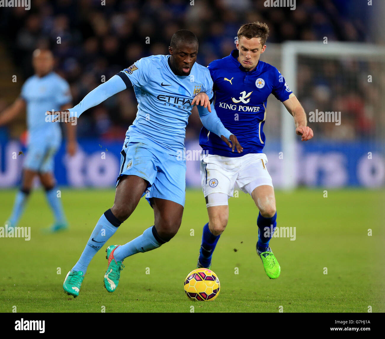 Manchester City's Yaya Toure (left) and Leicester City's Andy King battle for the ball during the Barclays Premier League match at the King Power Stadium, Leicester. PRESS ASSOCIATION Photo. Picture date: Saturday December 13, 2014. See PA story SOCCER Leicester. Photo credit should read Nick Potts/PA Wire. Maximum 45 images during a match. No video emulation or promotion as 'live'. No use in games, competitions, merchandise, betting or single club/player services. No use with unofficial audio, video, data, fixtures or club/league logos. Stock Photo