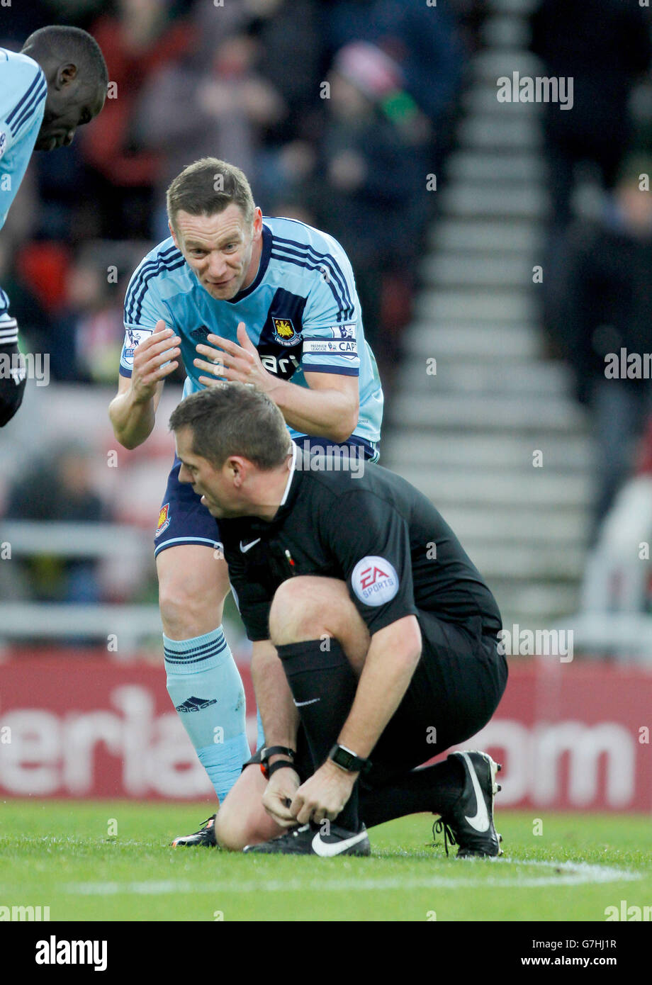West Ham United's Kevin Nolan pleads with referee Phil Dowd after Sunderland are awarded a penalty during the Barclays Premier League match at the Stadium of Light, Sunderland. Stock Photo
