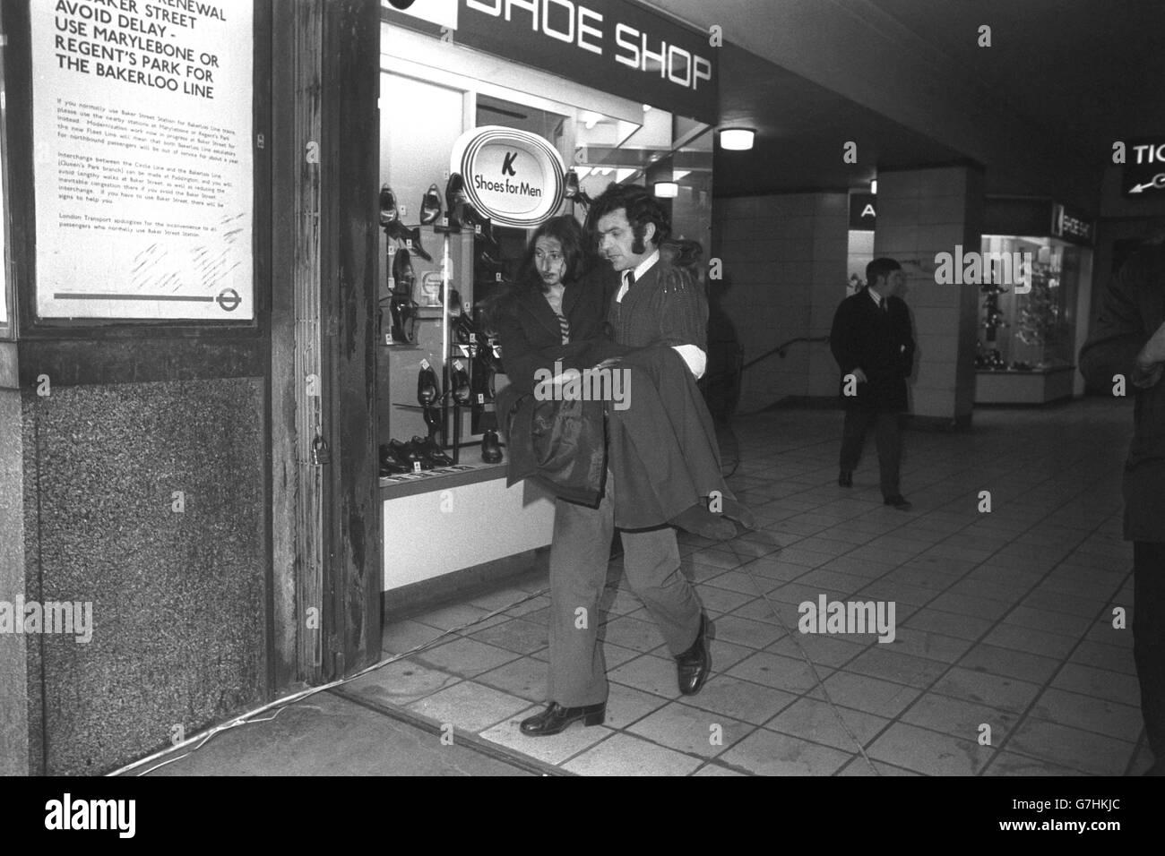 A shoeless young woman, injured in the Tube crash at Moorgate station, being carried to a waiting ambulance. Stock Photo