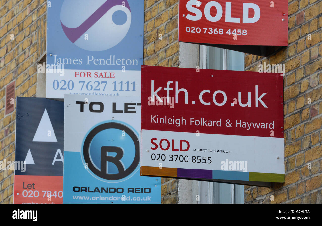 Estate agent's boards are seen in Clapham, London Stock Photo Alamy