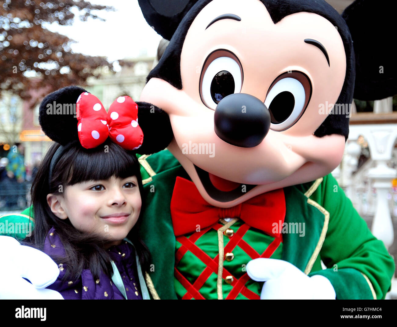 Abigail, nine, (surname not permitted) with Mickey Mouse during the charity trip to Disneyland Paris for under privileged children. PRESS ASSOCIATION Photo. Picture date: Tuesday December 16, 2014. Photo credit should read: Nick Ansell/PA Wire Stock Photo