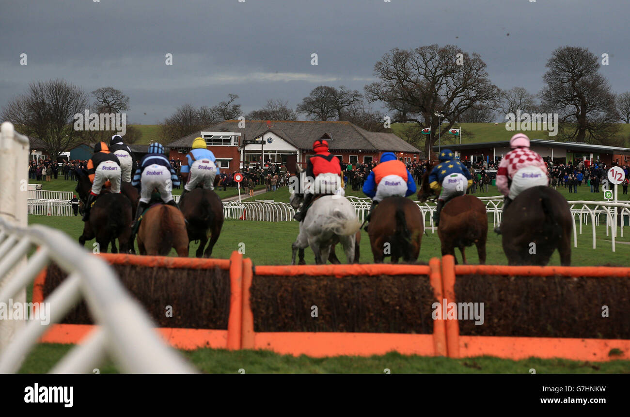 The runners and riders during the Equine Lens Handicap Hurdle at Bangor-on-Dee Racecourse, Bangor-on-Dee. Stock Photo