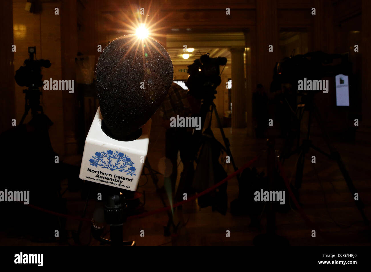 The media wait in the Great Hall at Parliament Buildings, Stormont, as political talks continue in Stormont House. Stock Photo