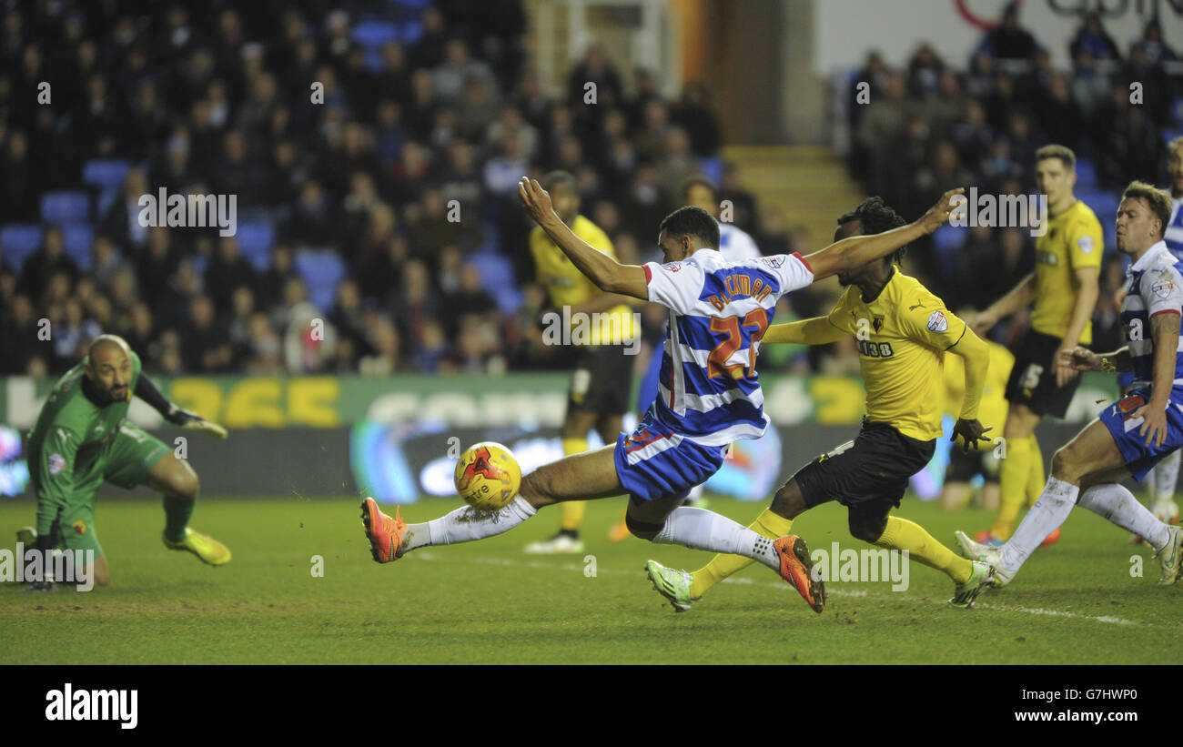 Reading's Nick Blackman is challenged by Watford's Juan Carlos Paredes as he lunges for the ball Stock Photo