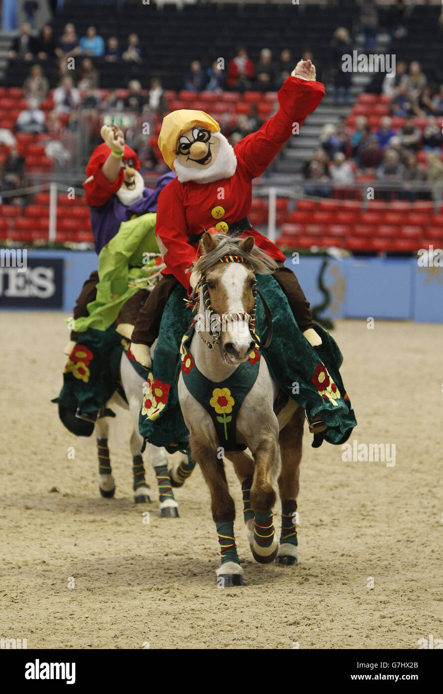 Members of the Saffron Walden & District Riding Club dress a the seven Dwarfs as they compete in the SEIB/British Riding Clubs Quadrille of the Year during day six of the Olympia London International Horse Show at the Olympia Exhibition Centre, London. Stock Photo