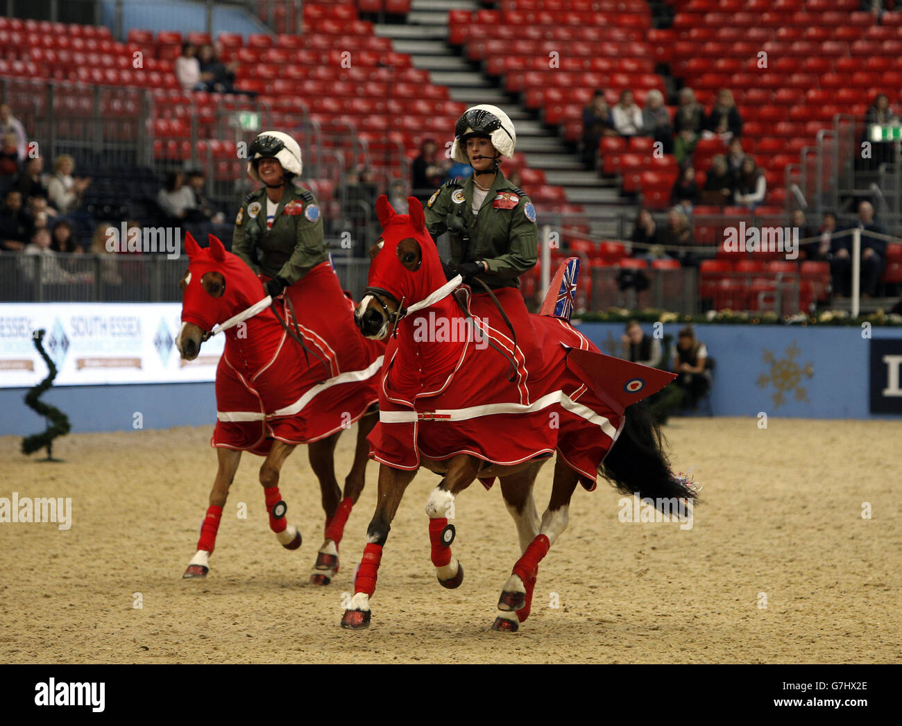 Members of the West Oxfordshire Riding Club dress as the RAF Red Arrows Display Team as they compete in the SEIB/British Riding Clubs Quadrille of the Year during day six of the Olympia London International Horse Show at the Olympia Exhibition Centre, London. Stock Photo